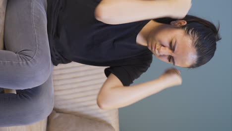 Vertical-video-of-Young-woman-slapping-herself-with-a-nervous-breakdown.